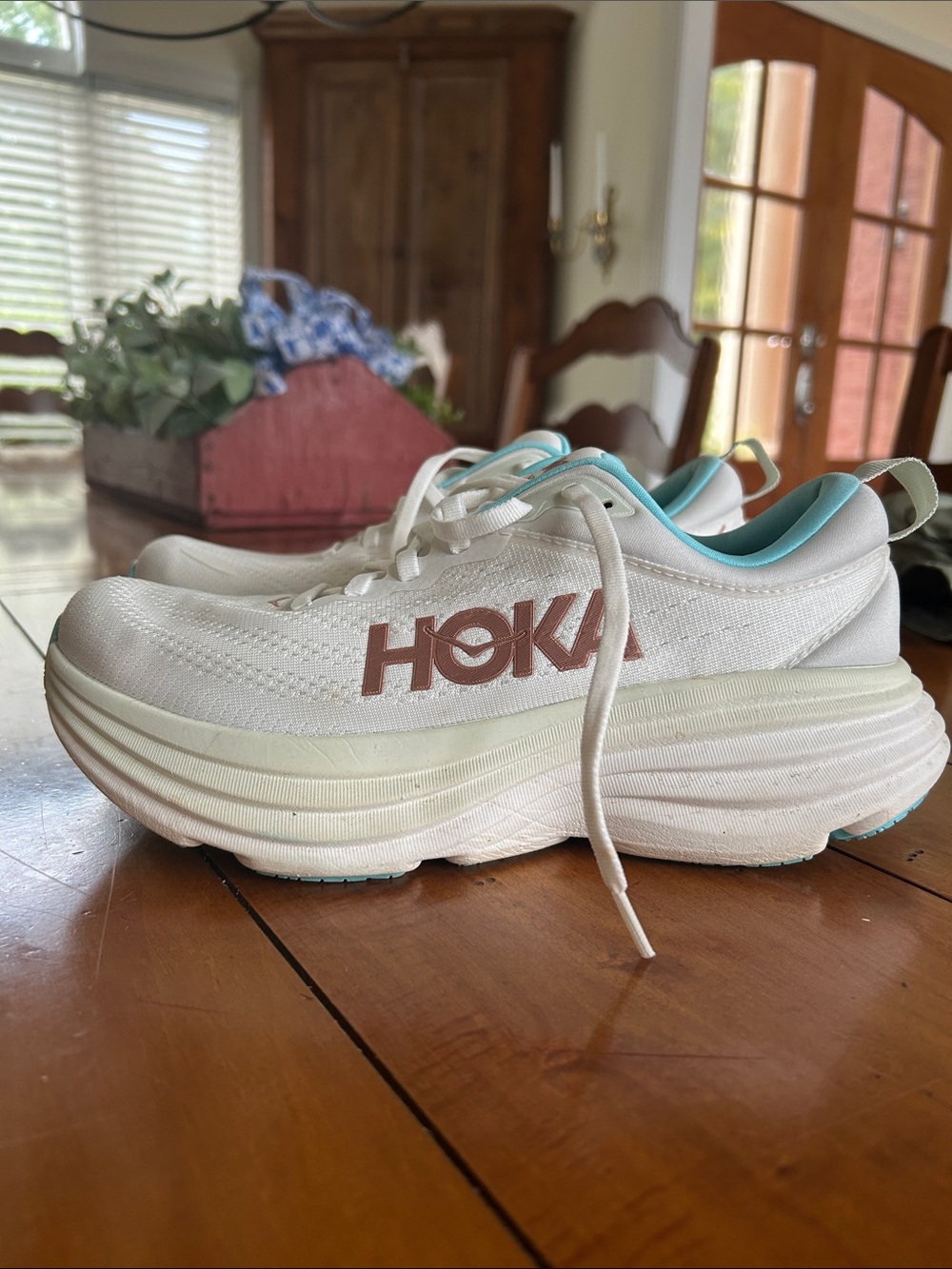 Hoka White Running Shoes with Teal Lining and Rose-Gold Logo